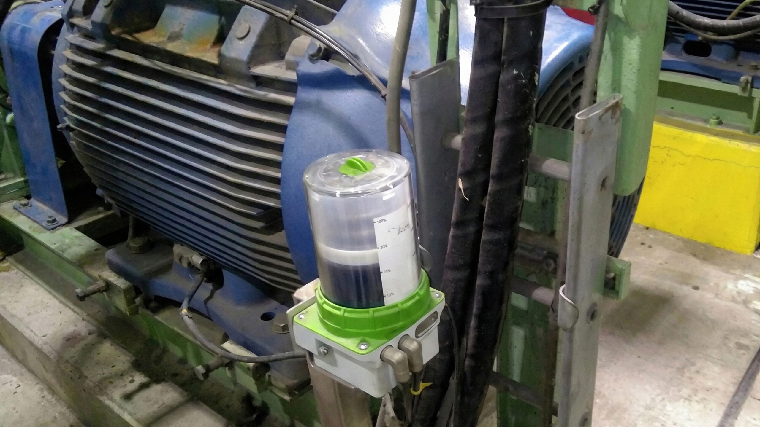 Wi-care 200 Inline oil condition monitoring sensor installed on industrial motor